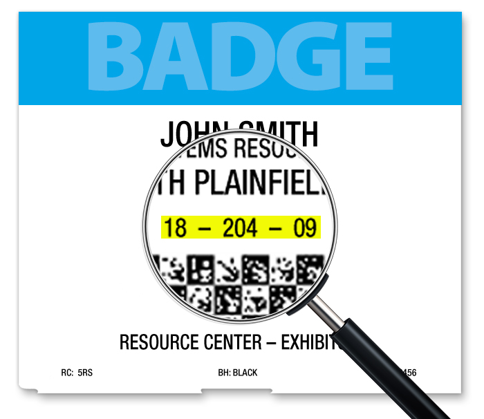 Name badge with magnifying glass displaying attendee registration number