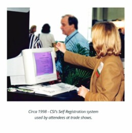 Woman in 1998 using CSI's self-registration system for attendees at a trade show