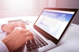 Attendee registering online through a laptop