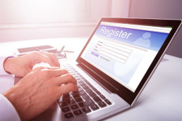 Attendee registering online through a laptop