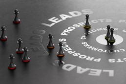 Chess pieces symbolizing strategic planning, representing the integration of lead retrieval into your trade show marketing strategy.