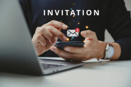 Integrated Invites, man holding phone getting an integrated invite via email