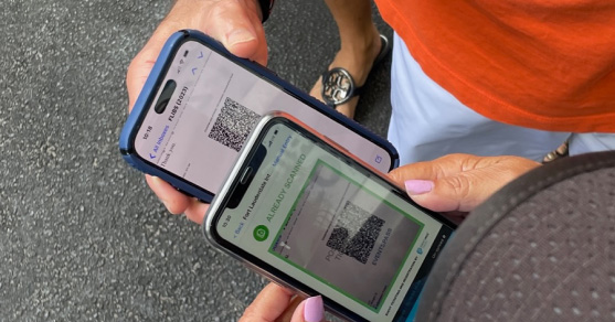 Attendee scanning QR code at event by utilizing an advanced ticketing platform